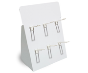 Set of silver earrings on a white display stand against a white background